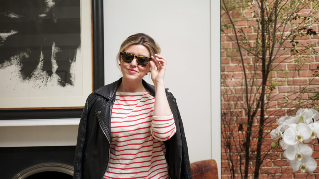 Mary wearing a striped top and sunglasses.