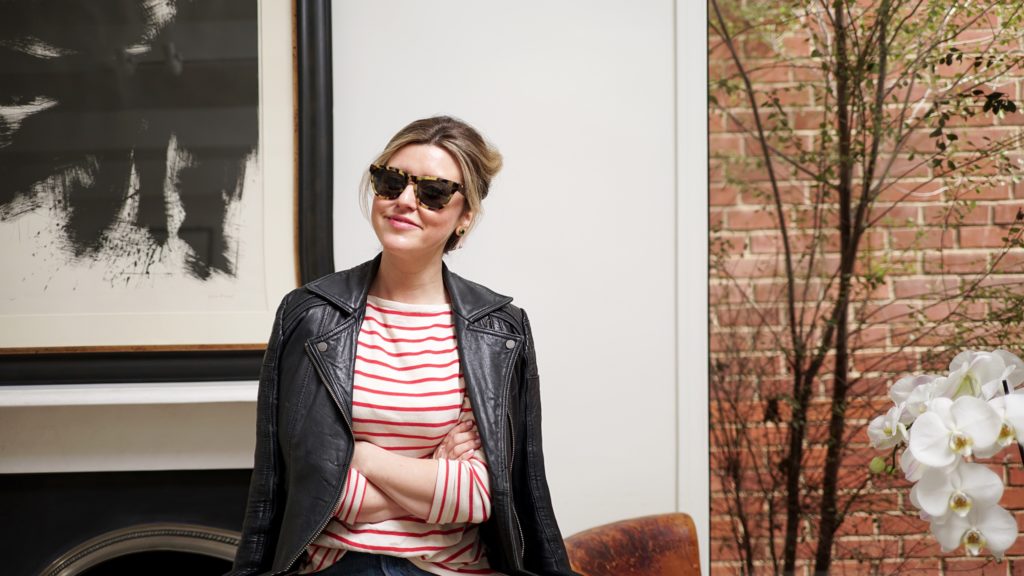 Mary wearing a striped top and sunglasses.