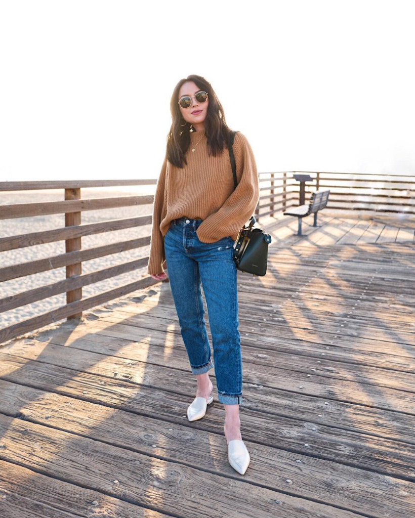 Blogger wearing relaxed jeans and knit sweater.