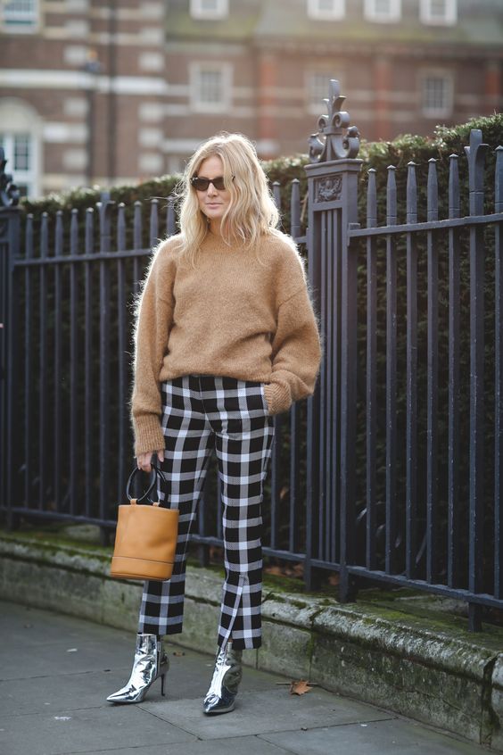 Blogger wearing metallic accents with a knit sweater.