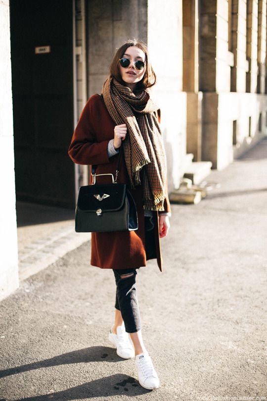 Blogger showing how to layer pieces for colder weather.
