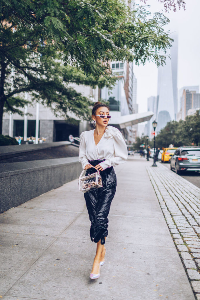 Blogger wearing patent leather skirt to add texture to work outfit.