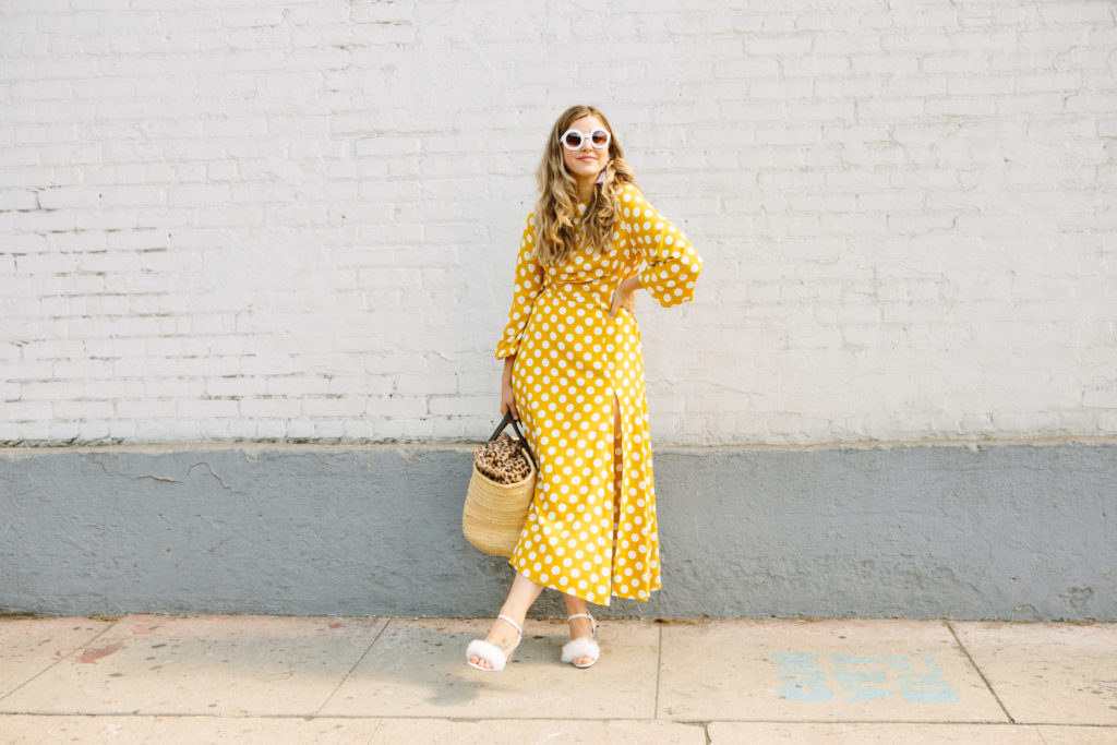 Mary wearing furry heels and yellow dress in a single photo.