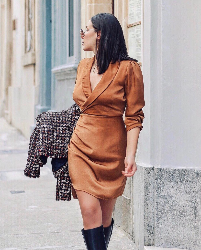 Blogger wearing beige and copper dress.