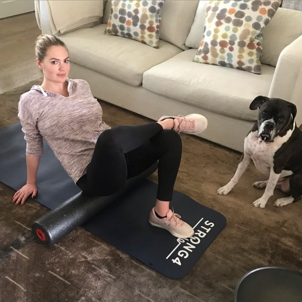 Kate Upton doing a workout at home.