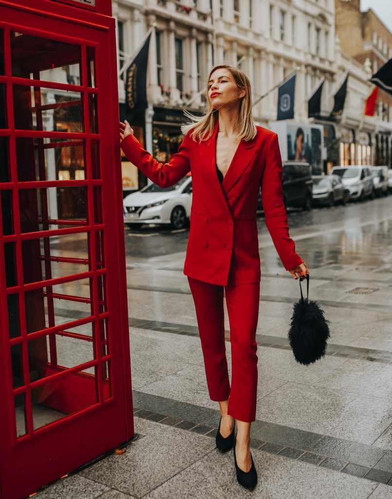 Woman wearing red suit for Valentine's Day.