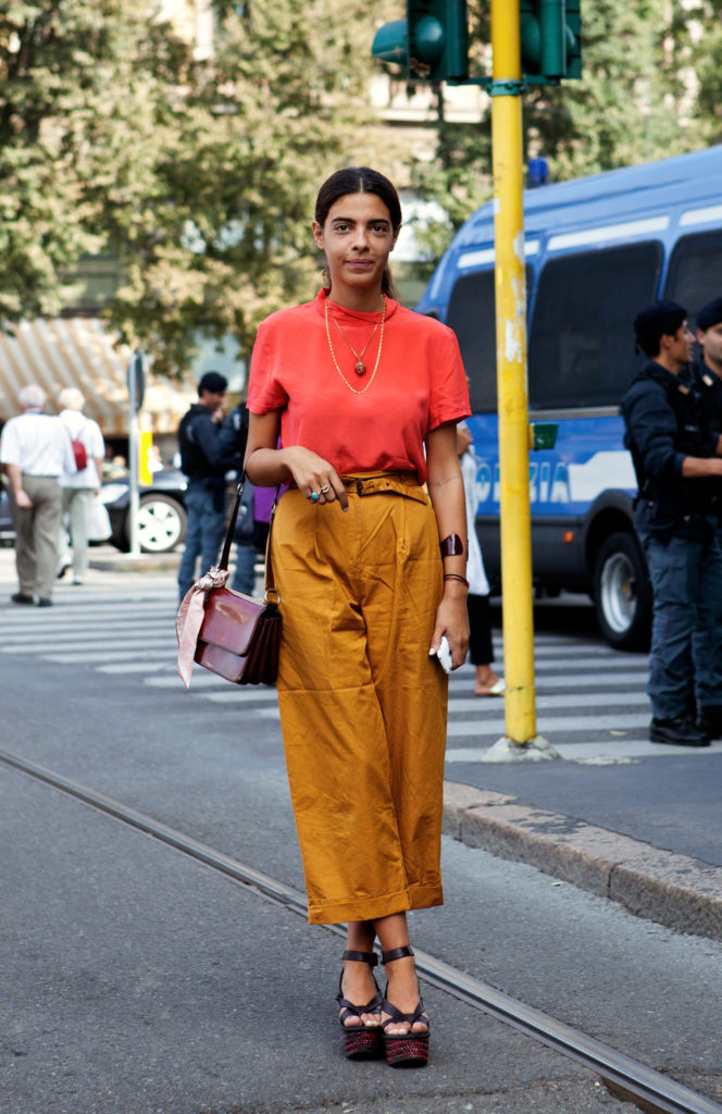 Woman wearing neon with muted colors.