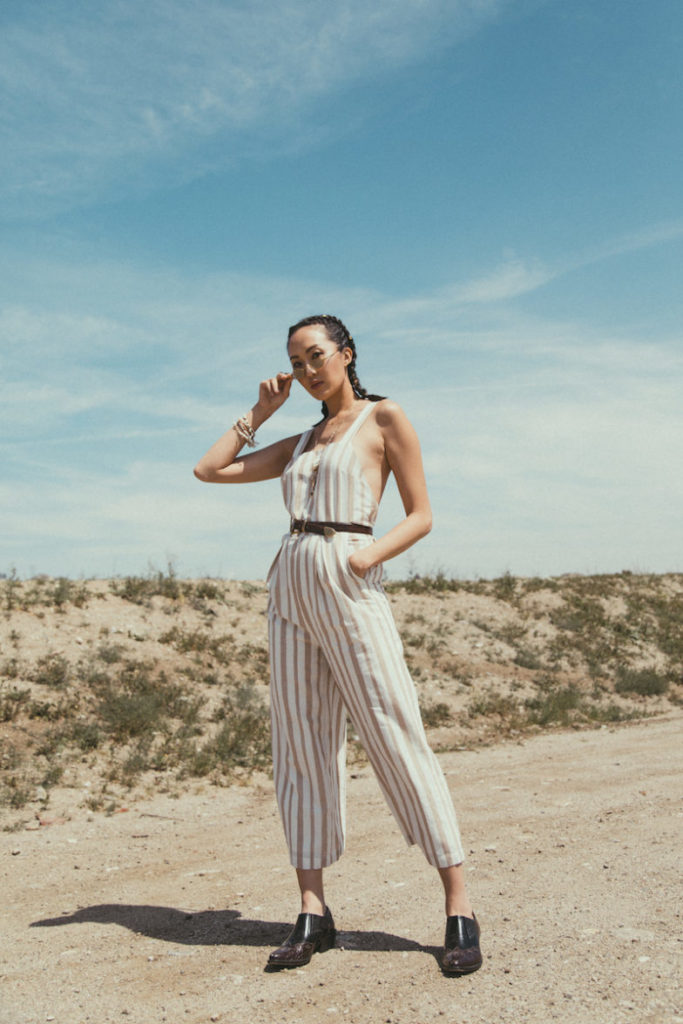 Blogger wearing a striped jumpsuit.
