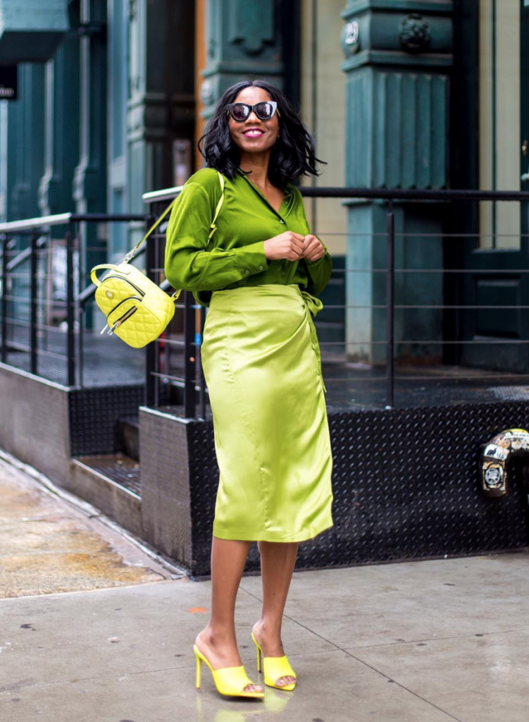 Woman wearing all brightly colored pieces.