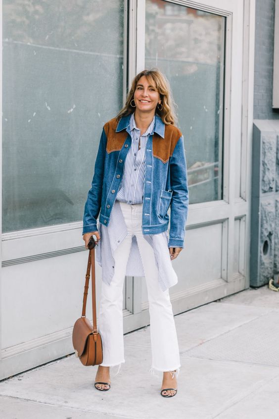 Woman wearing white bootcut denim as inspiration for fall styles.