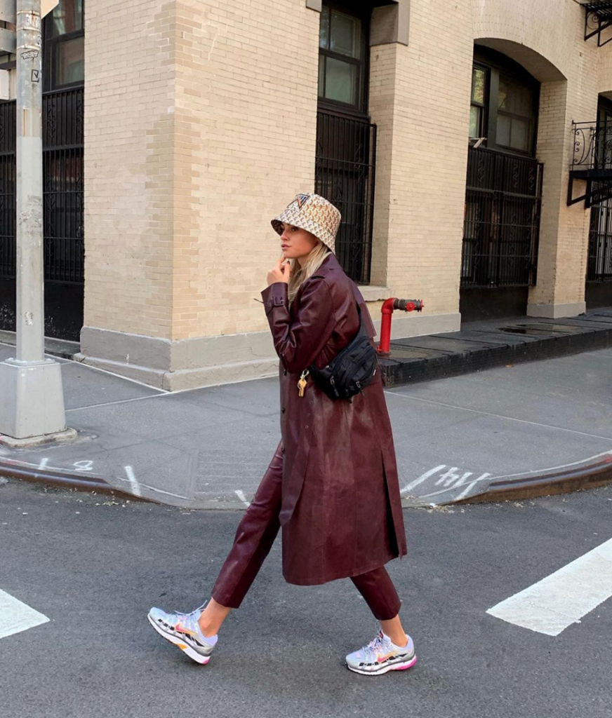 Woman wearing red leather overcoat as possible trend for new york fashion week.