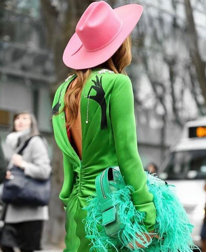Top editors Anna Dello Russo in a green dress and pink hat.