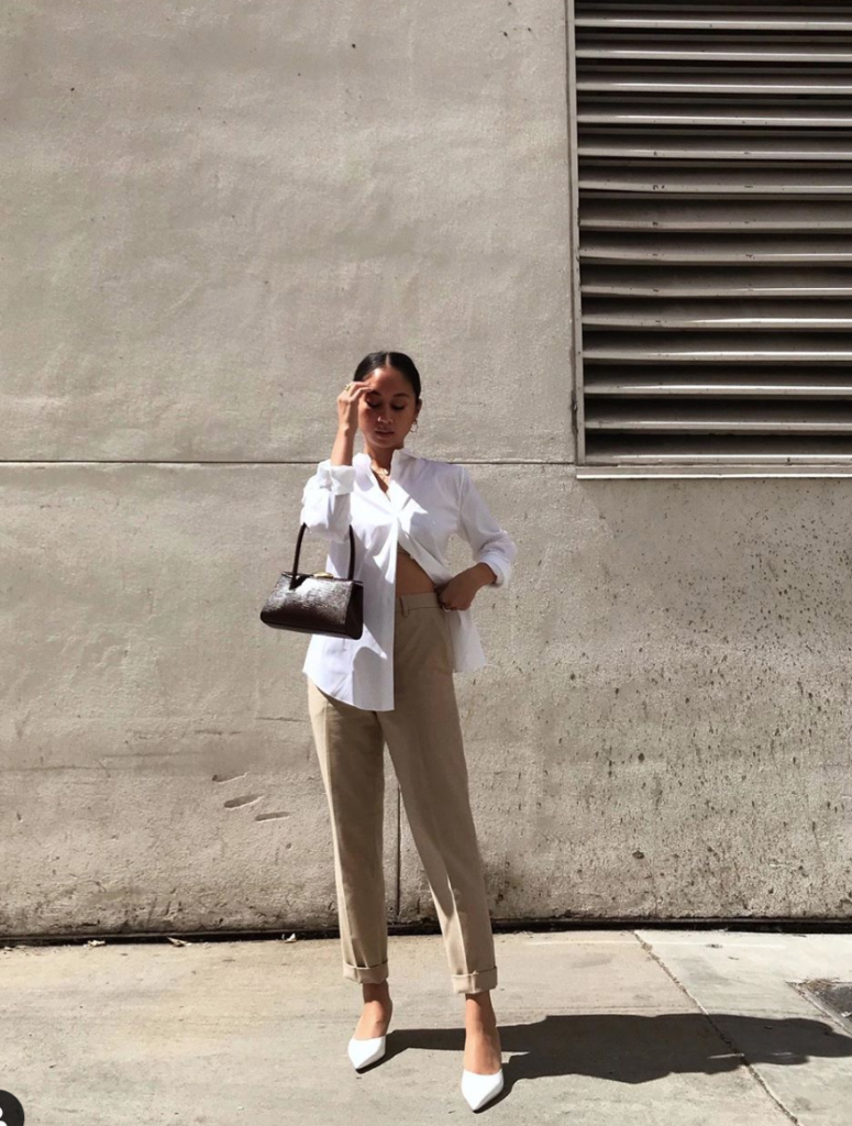 Blogger wearing neutrals in the form of khaki pants and whtie button up.