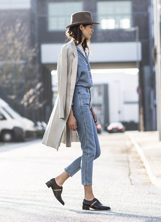 Woman wearing all denim with ankle booties as one of the formulas.