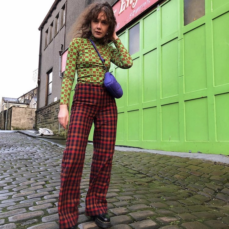 Woman in checked pants
