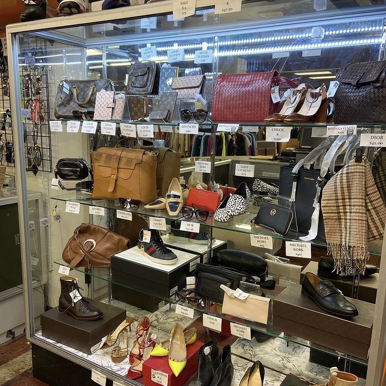 photo of a glass case filled with designer accessories