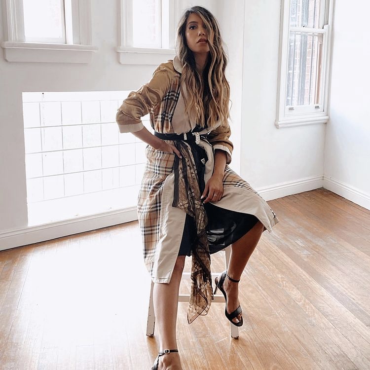 Photo of woman in thrifted Burberry coat