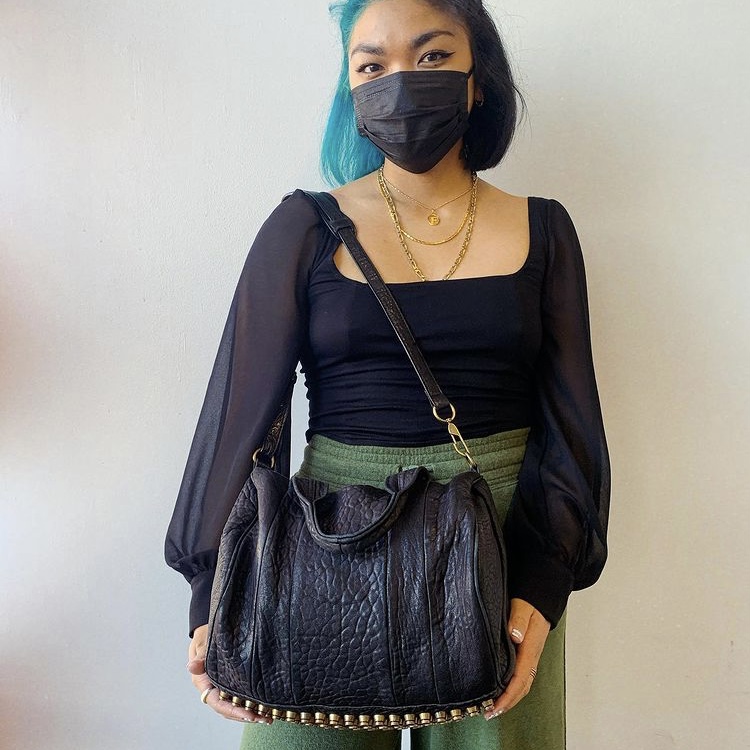 Photo of girl with designer handbag