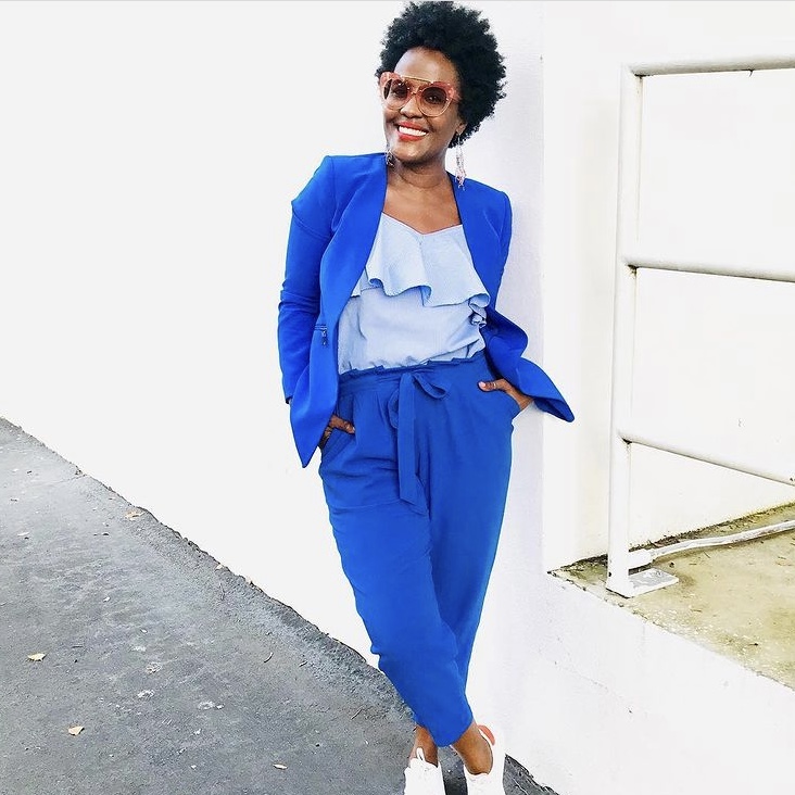 photo of woman wearing outfit in blue