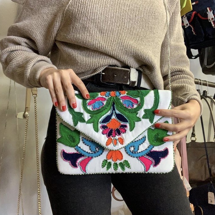 photo of woman with bold print purse