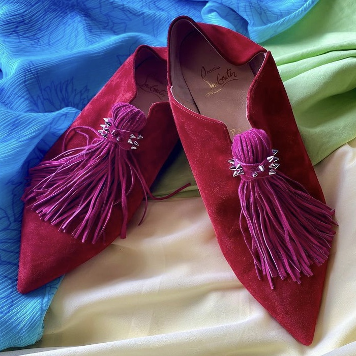 photo of red suede slipper shoes