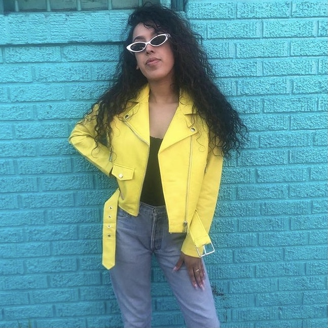 photo of woman with neon jacket