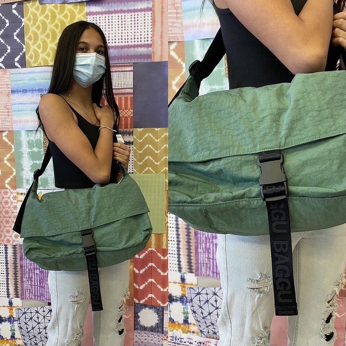 photo of green messenger bag from Our Selling Guide for the Utilitarian Trend