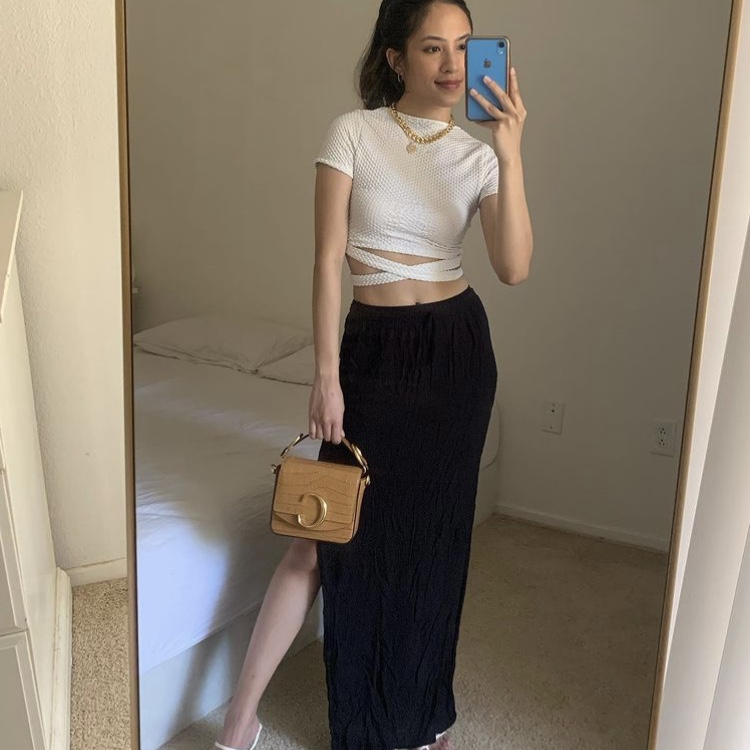 photo of woman in a crop top and black skirt