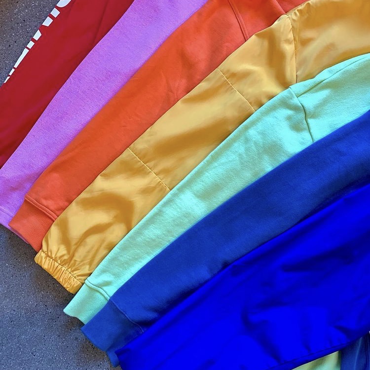 photo of a rainbow assortment of shirts