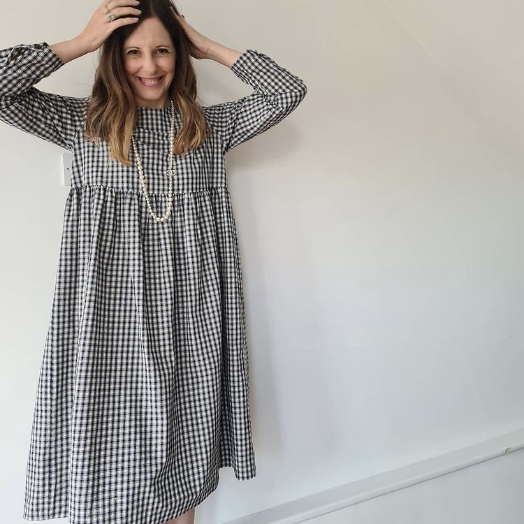 photo of person in checked house dress