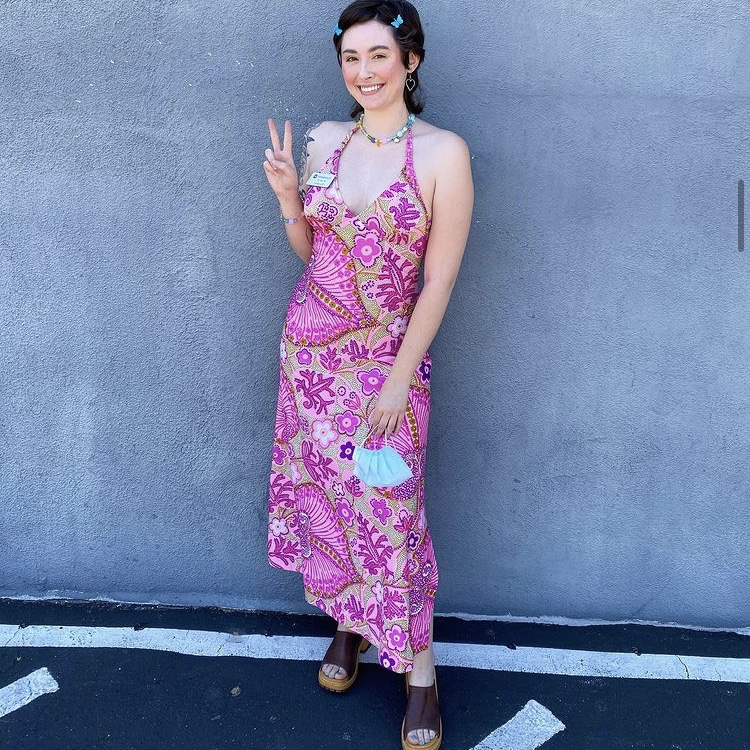 photo of person in bright floral dress