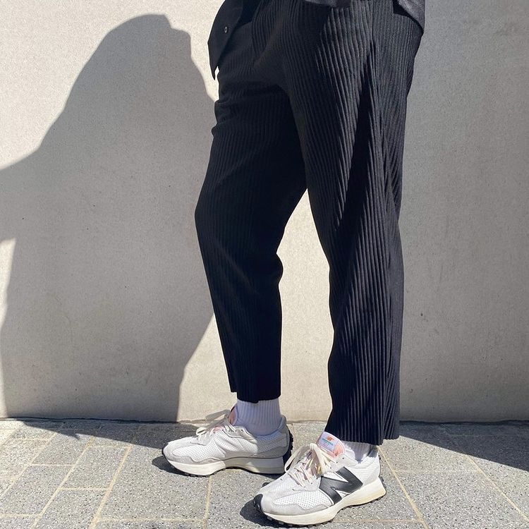 photo of black pleated pants