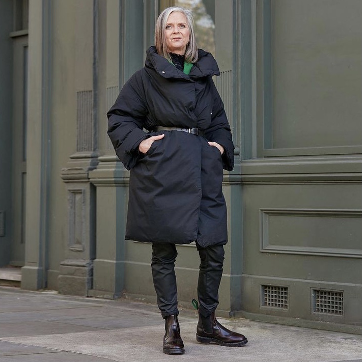 photo of person in black duvet coat