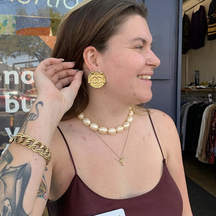 photo of person wearing Chanel earrings