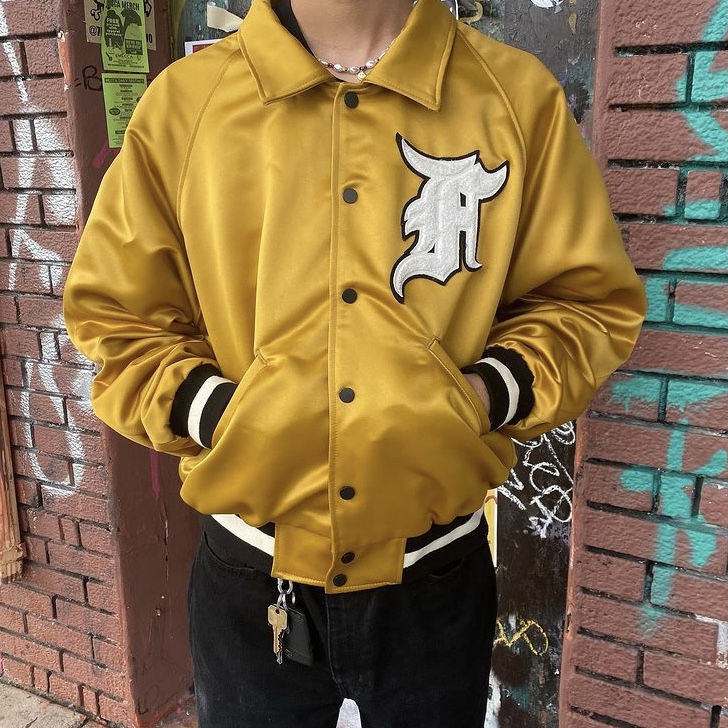 photo of person in varsity jacket