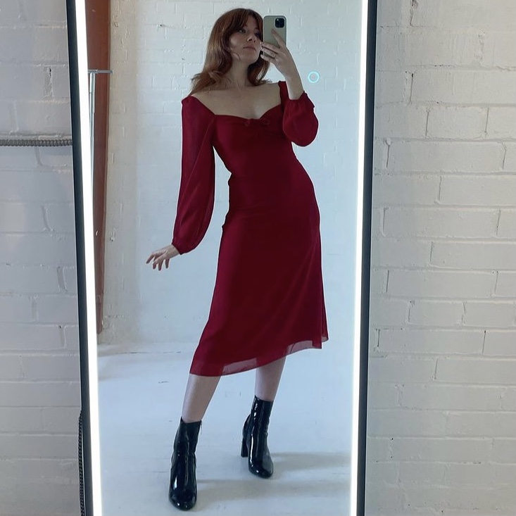 photo of person in red holiday dress