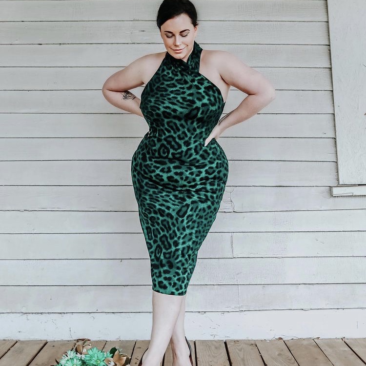 photo of person in green leopard dress