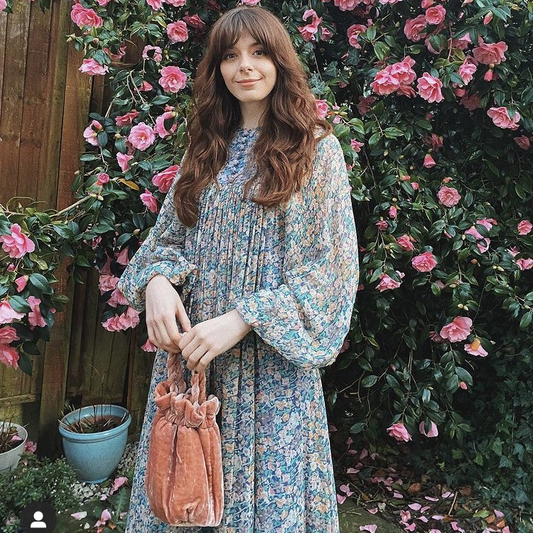 photo of person in floral print dress