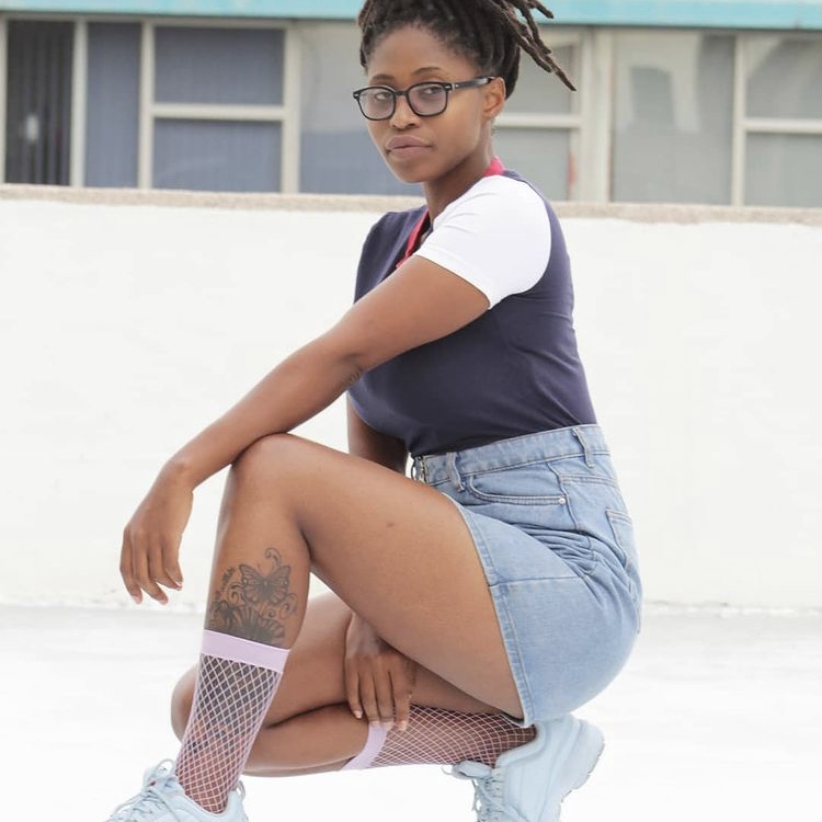 photo of person in jean skirt with socks
