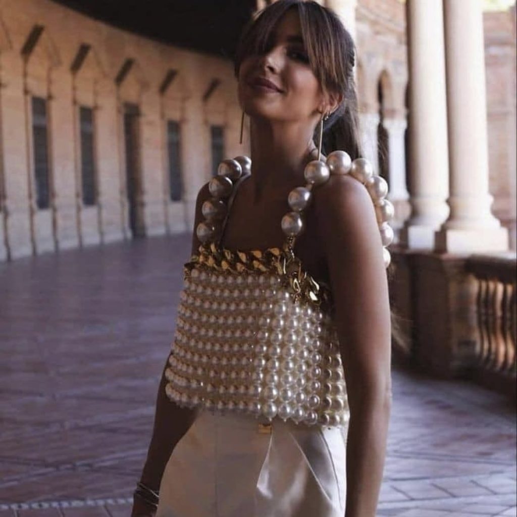 photo of person in beaded top