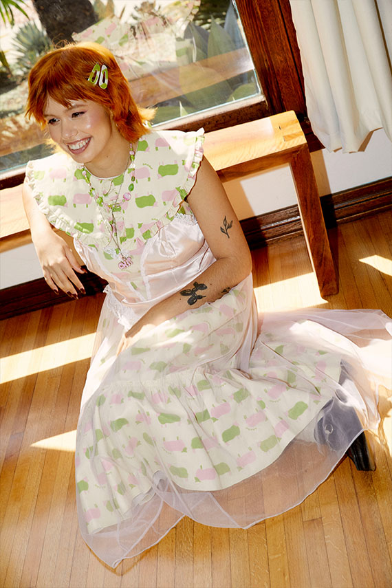 Jen sitting in a patterned dress