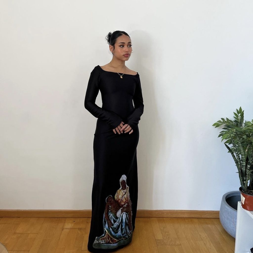 photo of person wearing long black dress