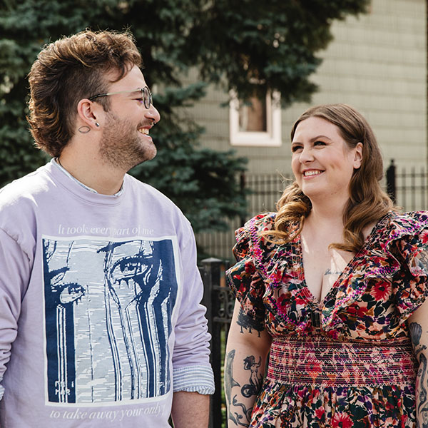John and Olivia smiling at each other