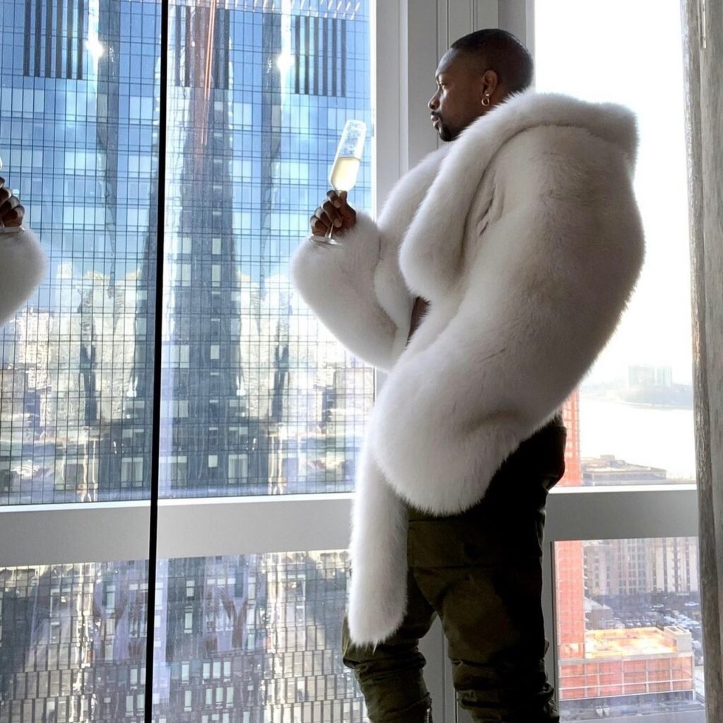 photo of person wearing white fur coat