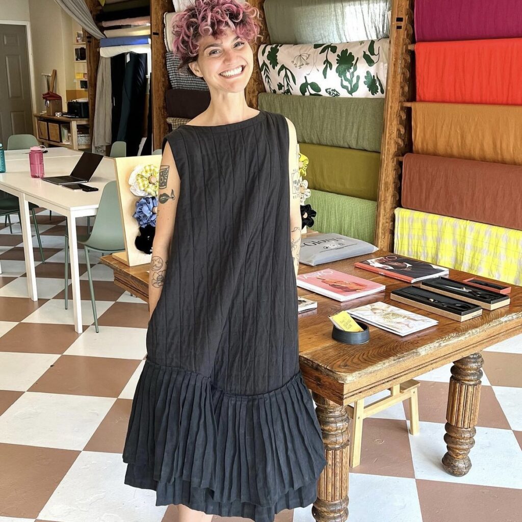 photo of person wearing pleated dress