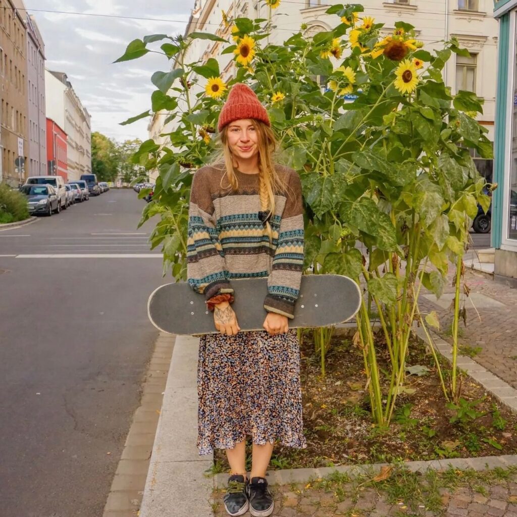 photo of person holding a skateboard
