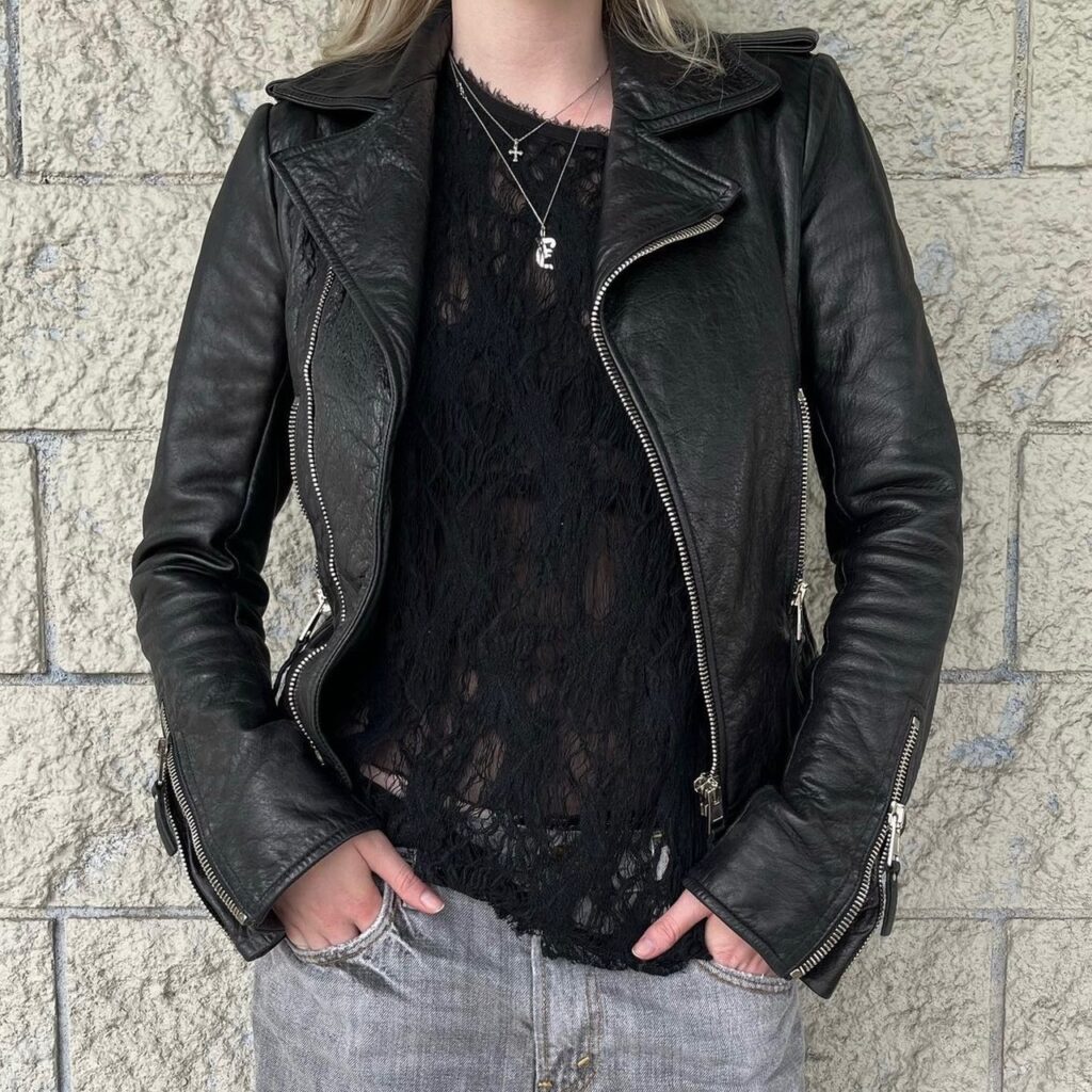 photo of a person wearing a black leather moto jacket