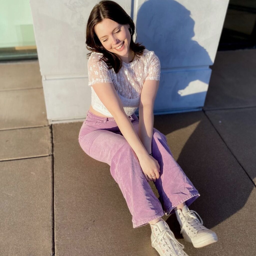 photo of a person in white top with pink pants