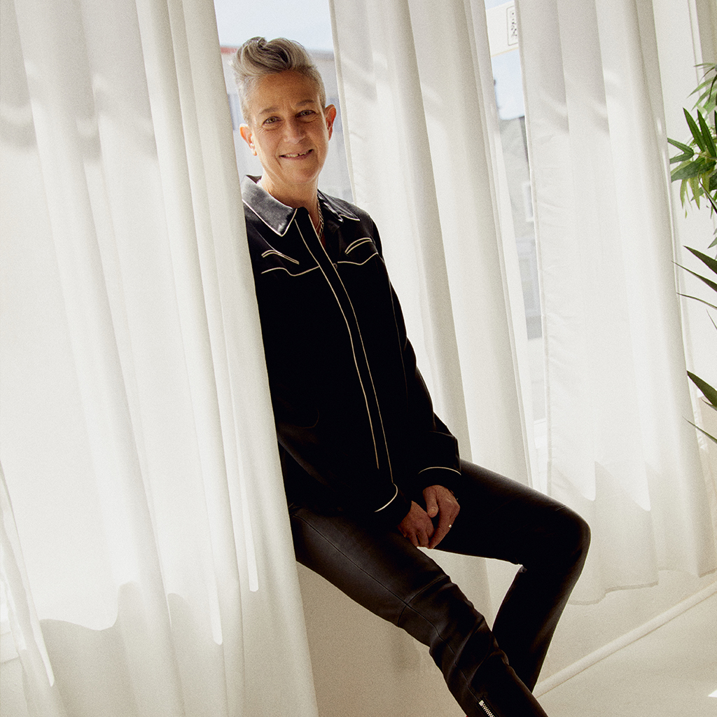 Melissa sitting on a window sill