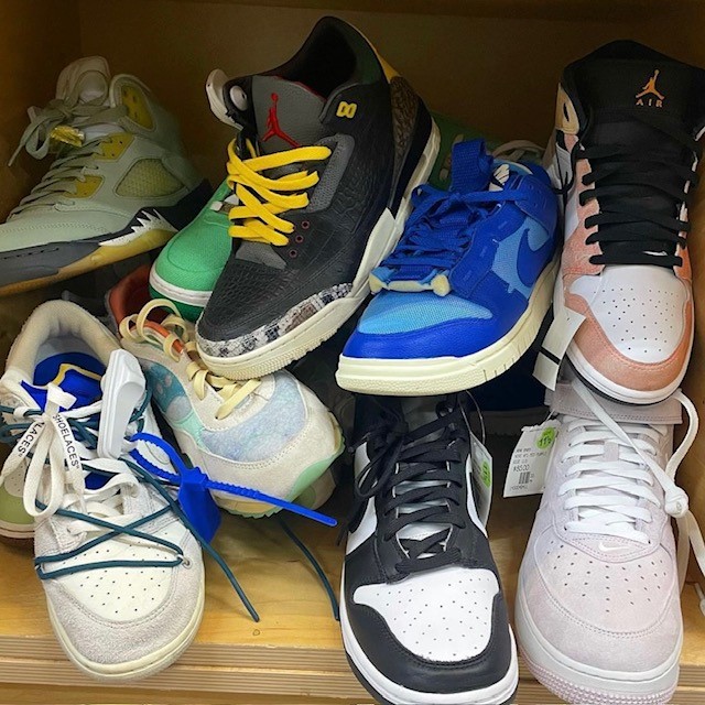 an example of thrift store fashion, a pile of sneakers
